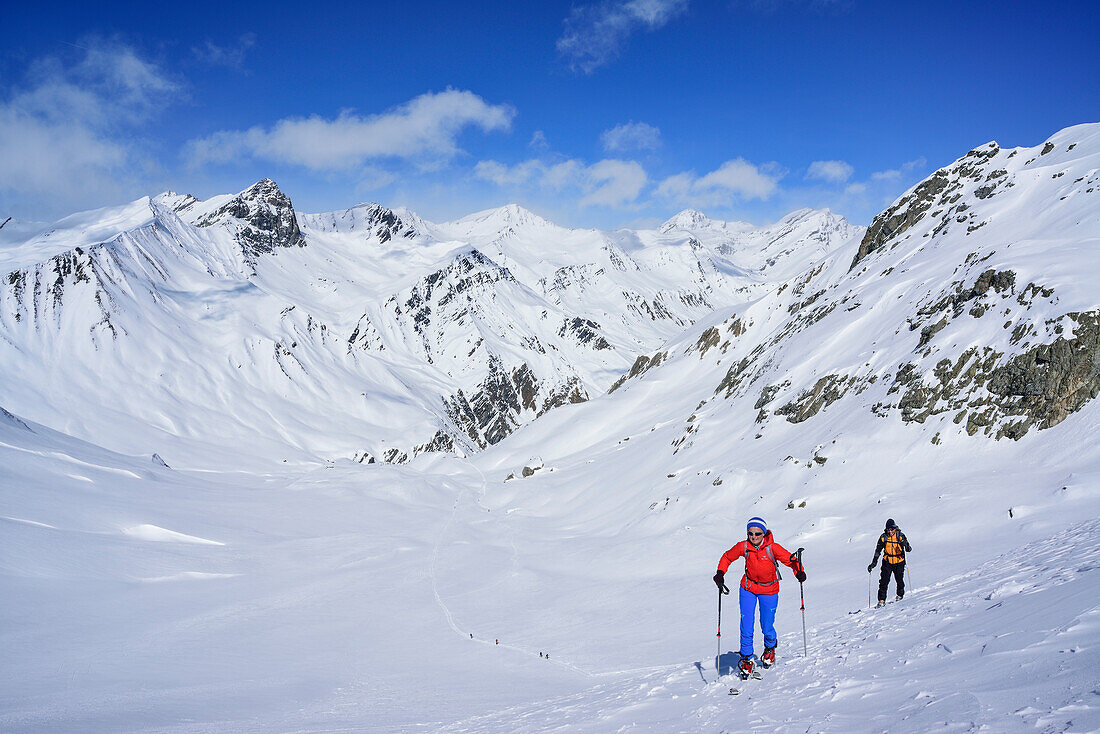 Two persons back-country skiing ascending towards Monte Faraut, Monte Faraut, Valle Varaita, Cottian Alps, Piedmont, Italy