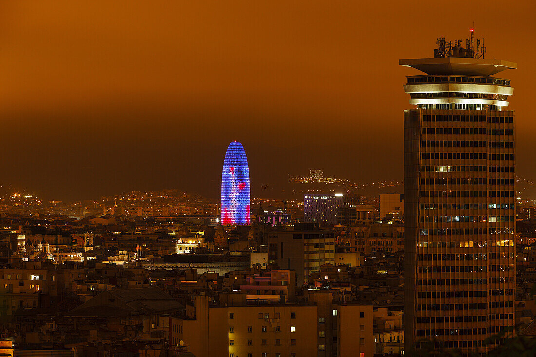 view across Barcelona from Montjuic mountain, Edificio Colon - Torre Maritima, architect Daniel Gelabert i Fontova, 1970, Torre Agbar, architect Jean Novel, 2004, LED-lighting, Barcelona, Catalunya, Catalonia , Spain, Europe