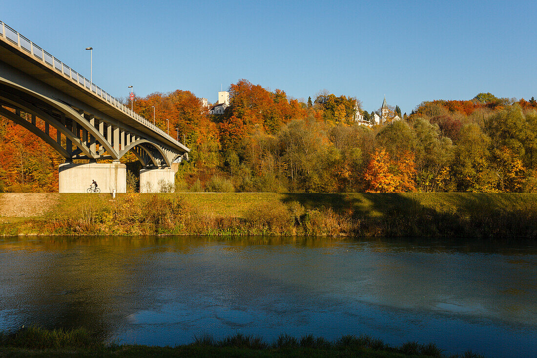 view from Brueckenwirt Restaurant to Gruenwald with bridge, Isar canal with Gruenwald Castle and church, beech trees in Autumn, Indian summer, Isar valley, Gruenwald, district Munich, Bavarian alpine foreland, Upper Bavaria, Bavaria, Germany, Europe