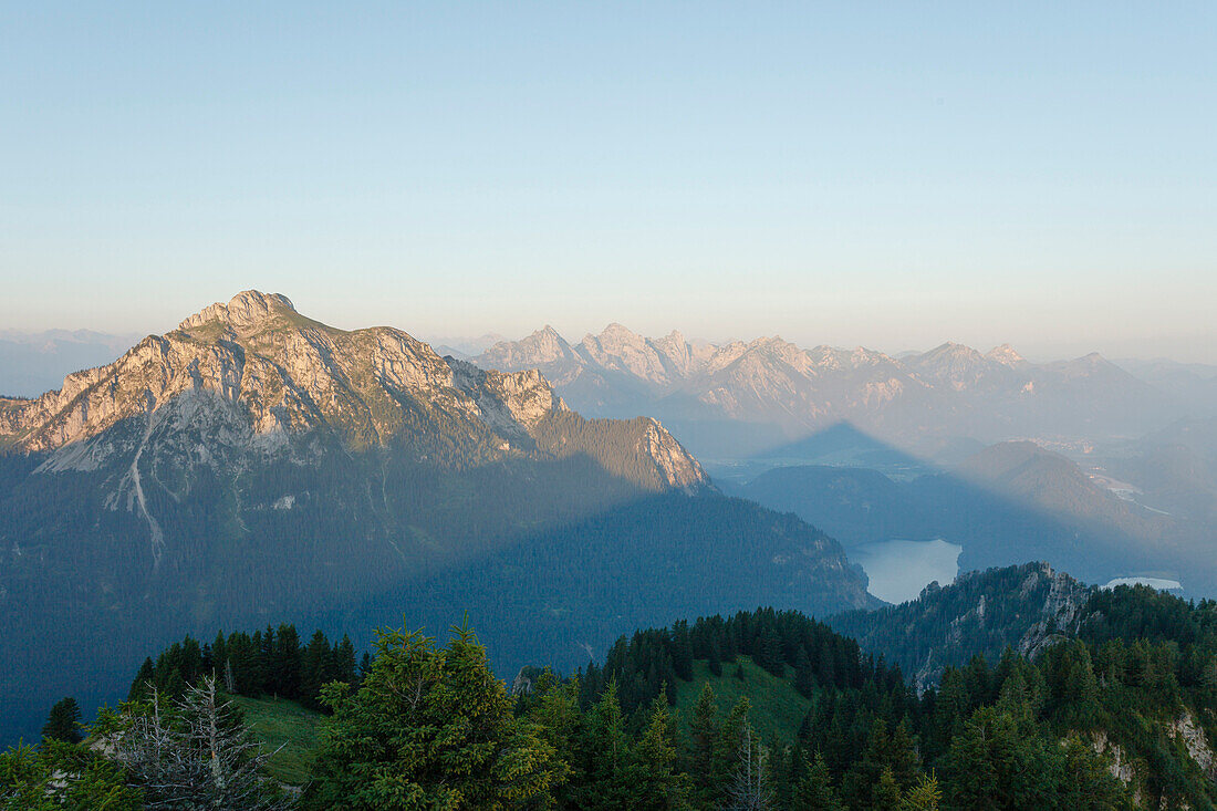 Shadow of Tegelberg mountain across lake Alpsee, Gassenthomaskopf, mountain, near Fuessen district Ostallgaeu, Swabia, Bavaria, Germany, Europe