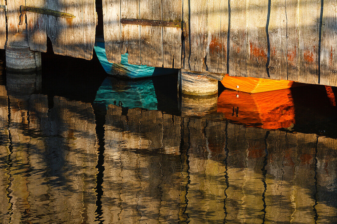 rowing boats in a boathouse on lake Staffelsee, reflection, Seehausen am Staffelssee, near Murnau, Blue Land, district Garmisch-Partenkirchen, Bavarian alpine foreland, Upper Bavaria, Bavaria, Germany, Europe