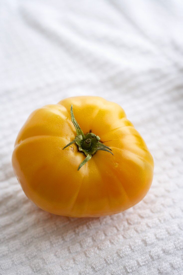 A Single Organic Yellow Heirloom Tomato