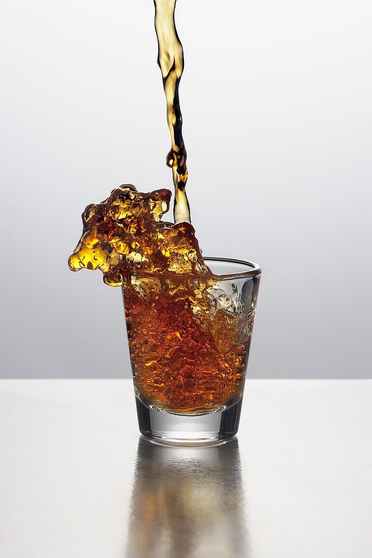Liquor Pouring into a Shot Glass