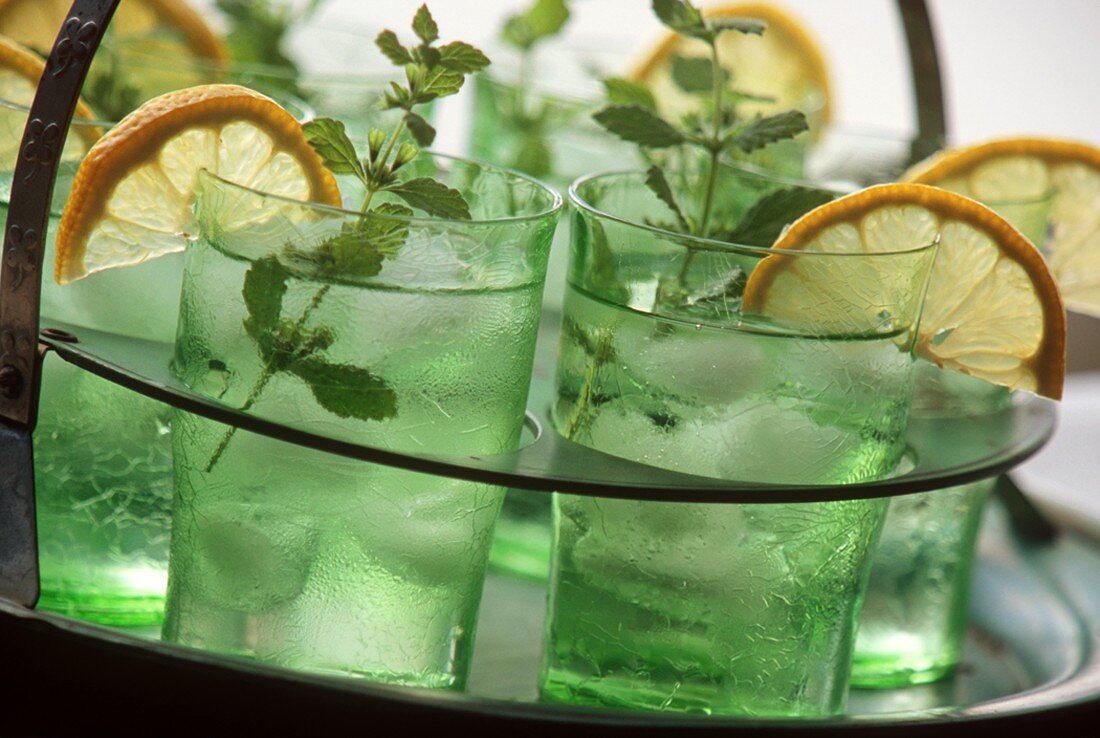 A Tray of Cocktails with Lemon and Mint