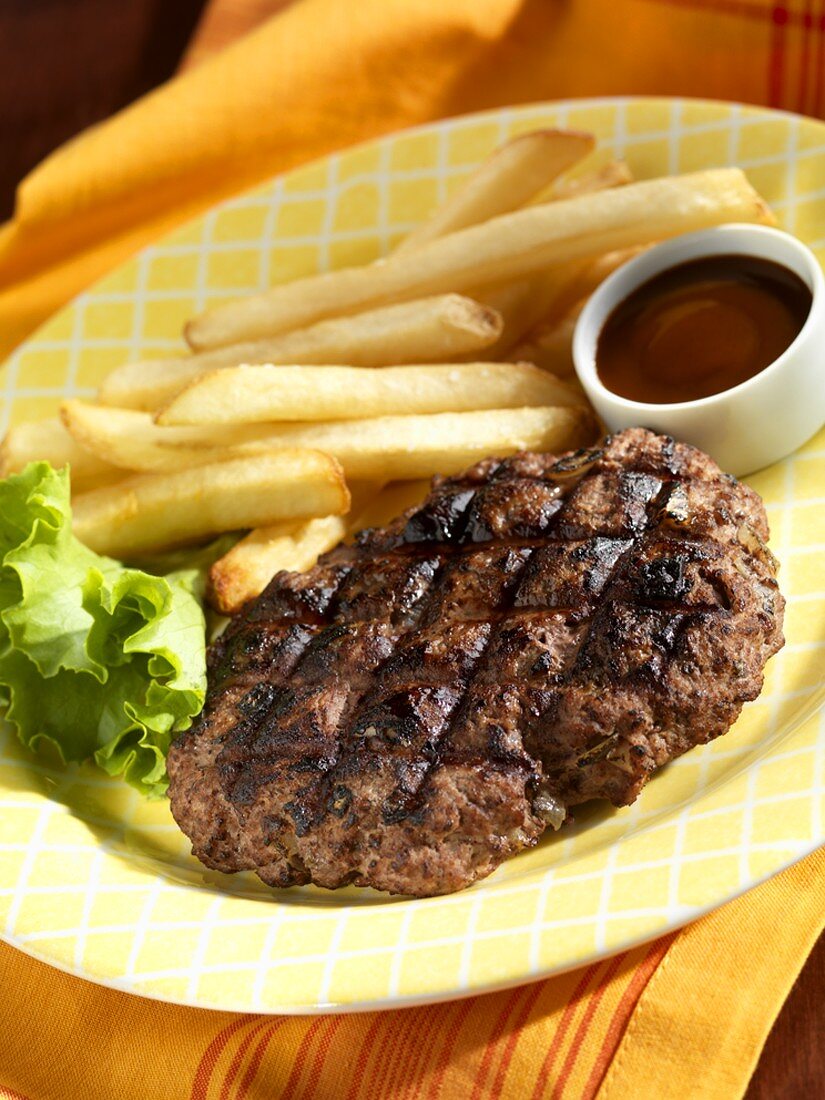 Grilled Chopped Steak with BBQ Sauce and French Fries