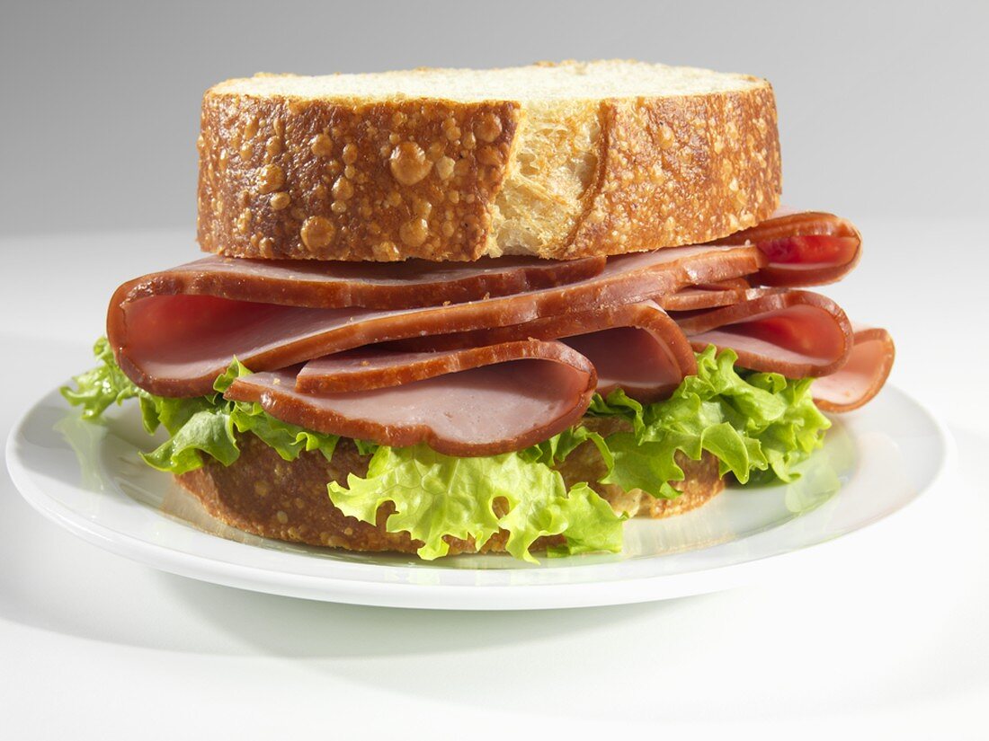A Ham Sandwich with Lettuce on Thick Cut Sourdough Bread