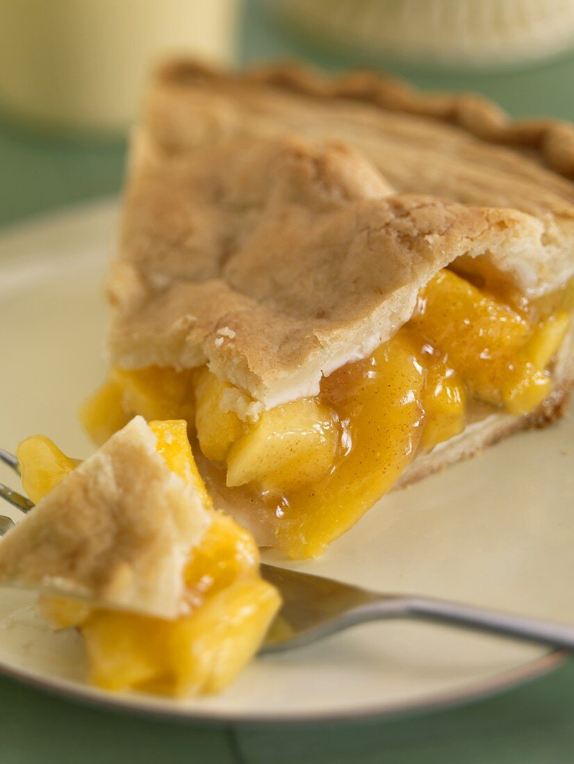 Slice of Peach Pie with a Fork
