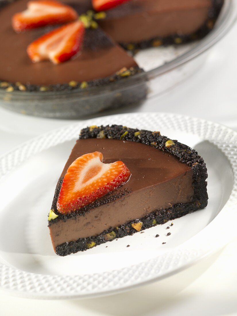 Slice of Dark Chocolate Velvet Pie with Sliced Strawberries