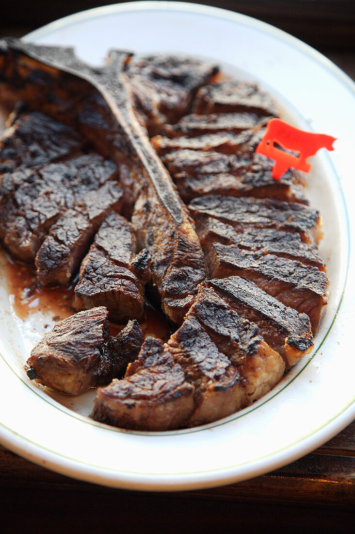 Sliced Porterhouse Steak on a Plate, Close Up