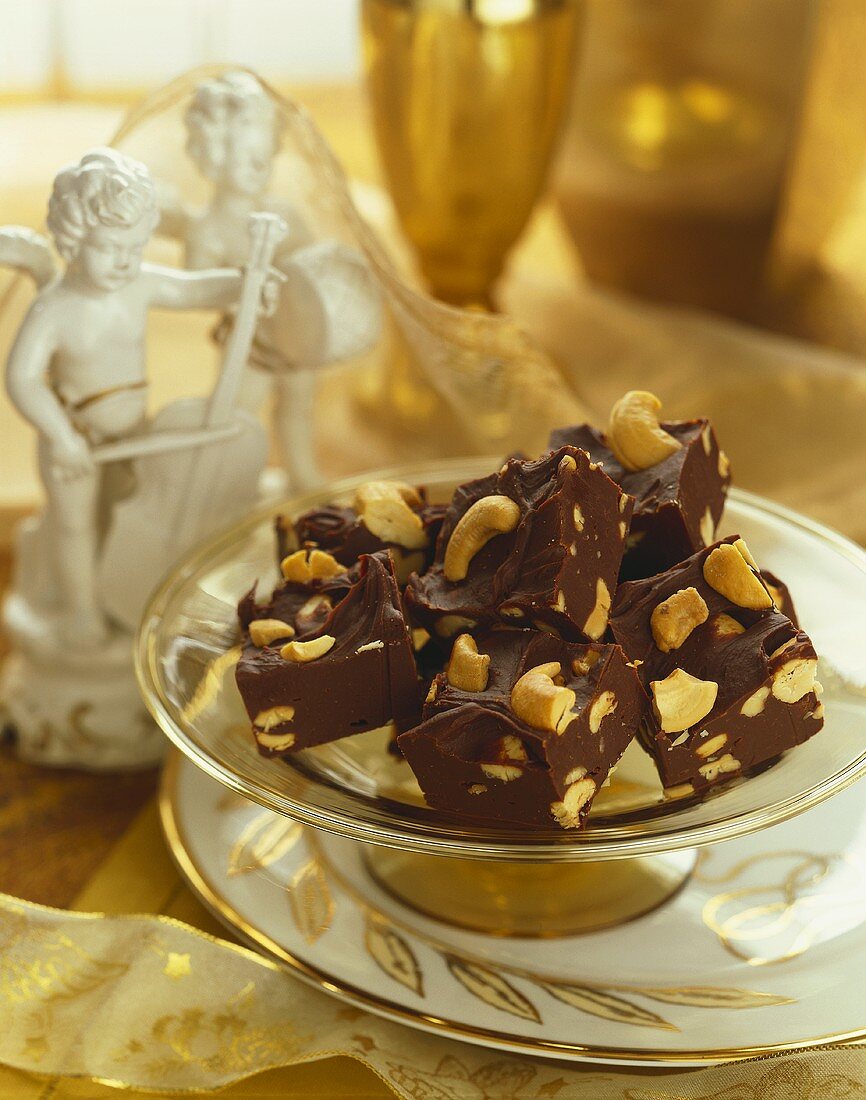 Cashew Nut Chocolate Fudge on a Dish, Statue and Ribbon