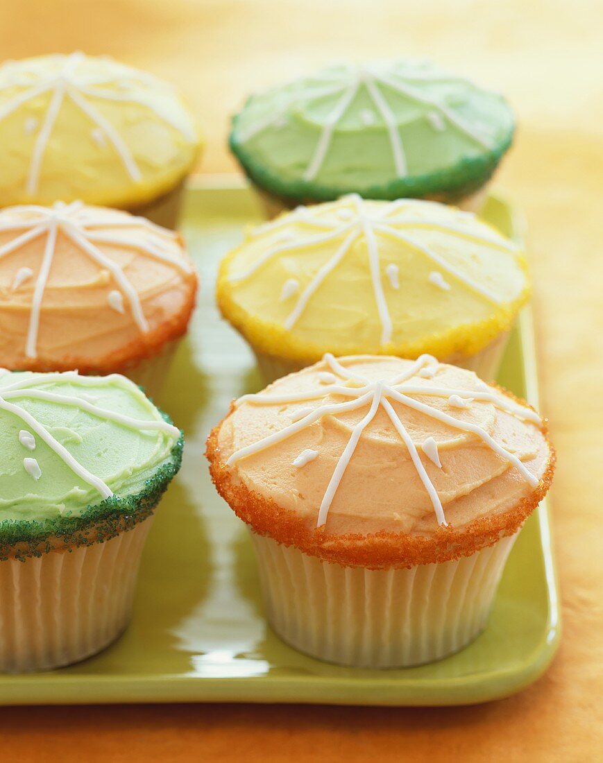 Orange, Green and Yellow Frosted Cupcakes with Sugar Crystals and Icing