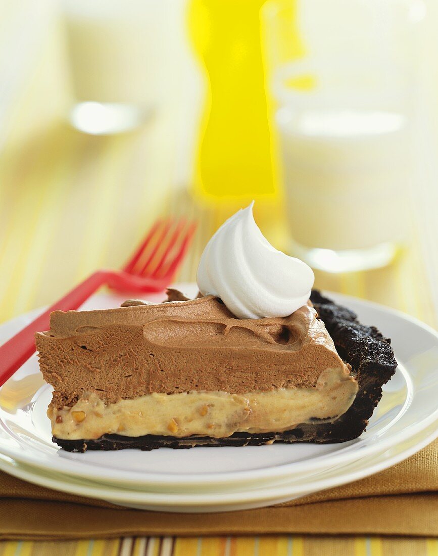 Slice of Chocolate Peanut Butter Pie With Whipped Cream, Plastic Fork