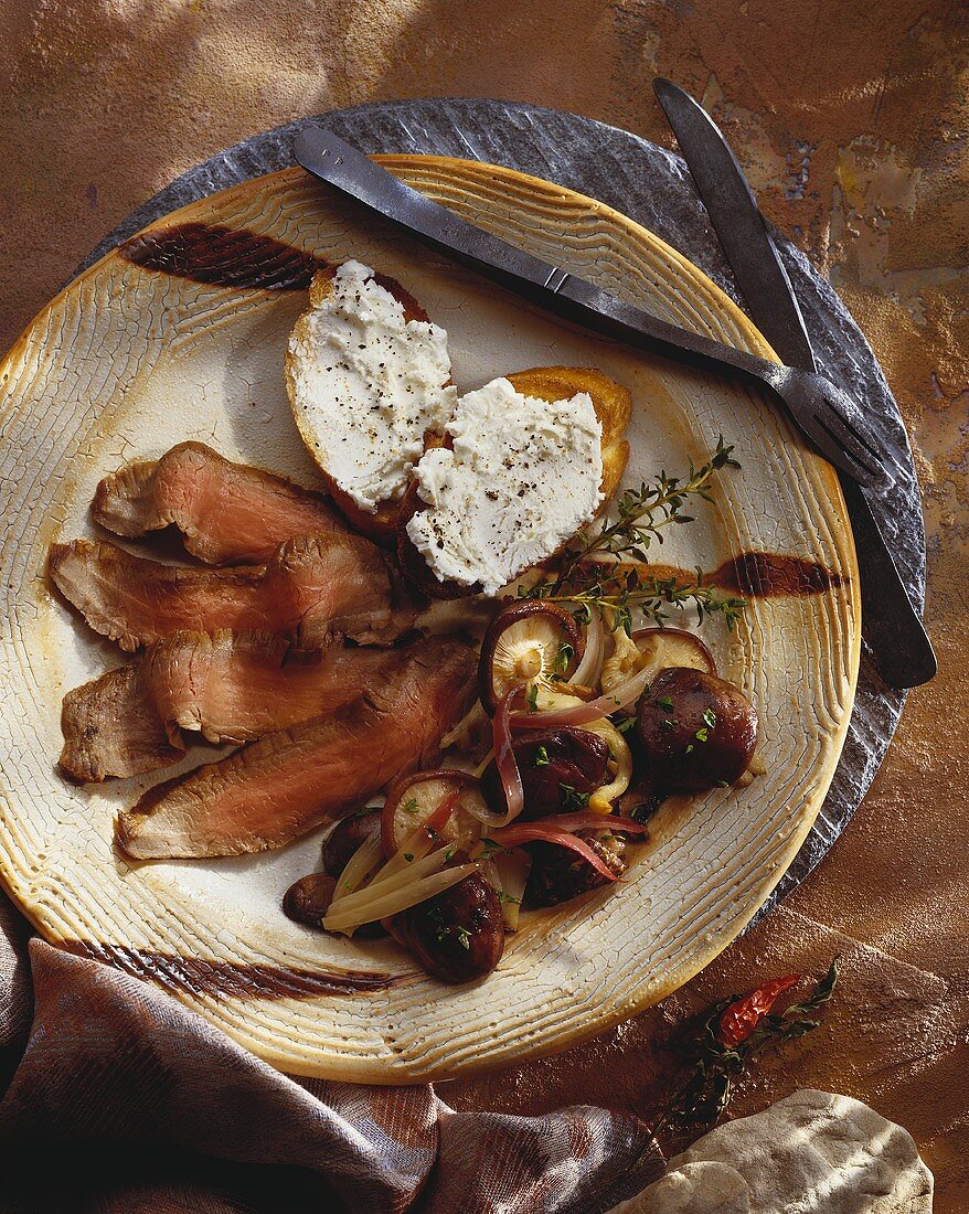 Sliced Flank Steak with Wild Mushrooms and Bruschetta with Cheese Spread, Rustic Utensils