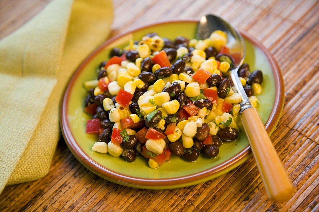 Small Plate of Corn and Black Bean Salad with a Spoon