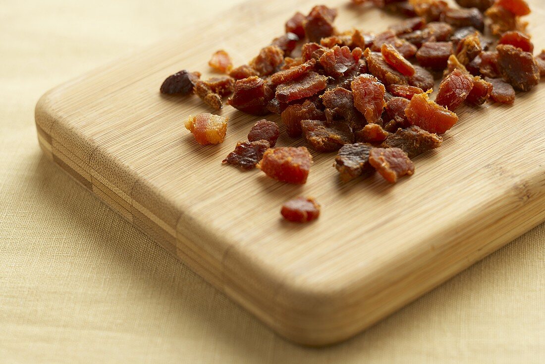 Bacon Bits on a Cutting Board; Close Up