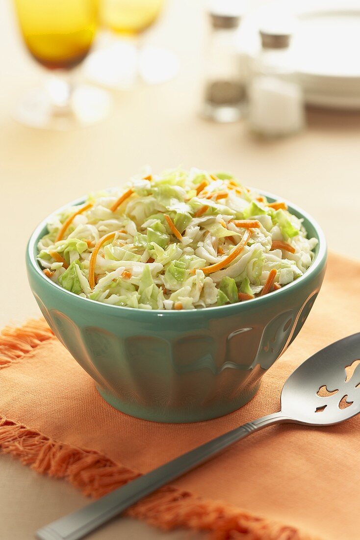 Bowl of Coleslaw with Serving Spoon