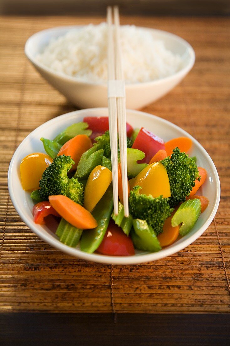 Chinese Vegetables and a Bowl of White Rice; Chop Sticks