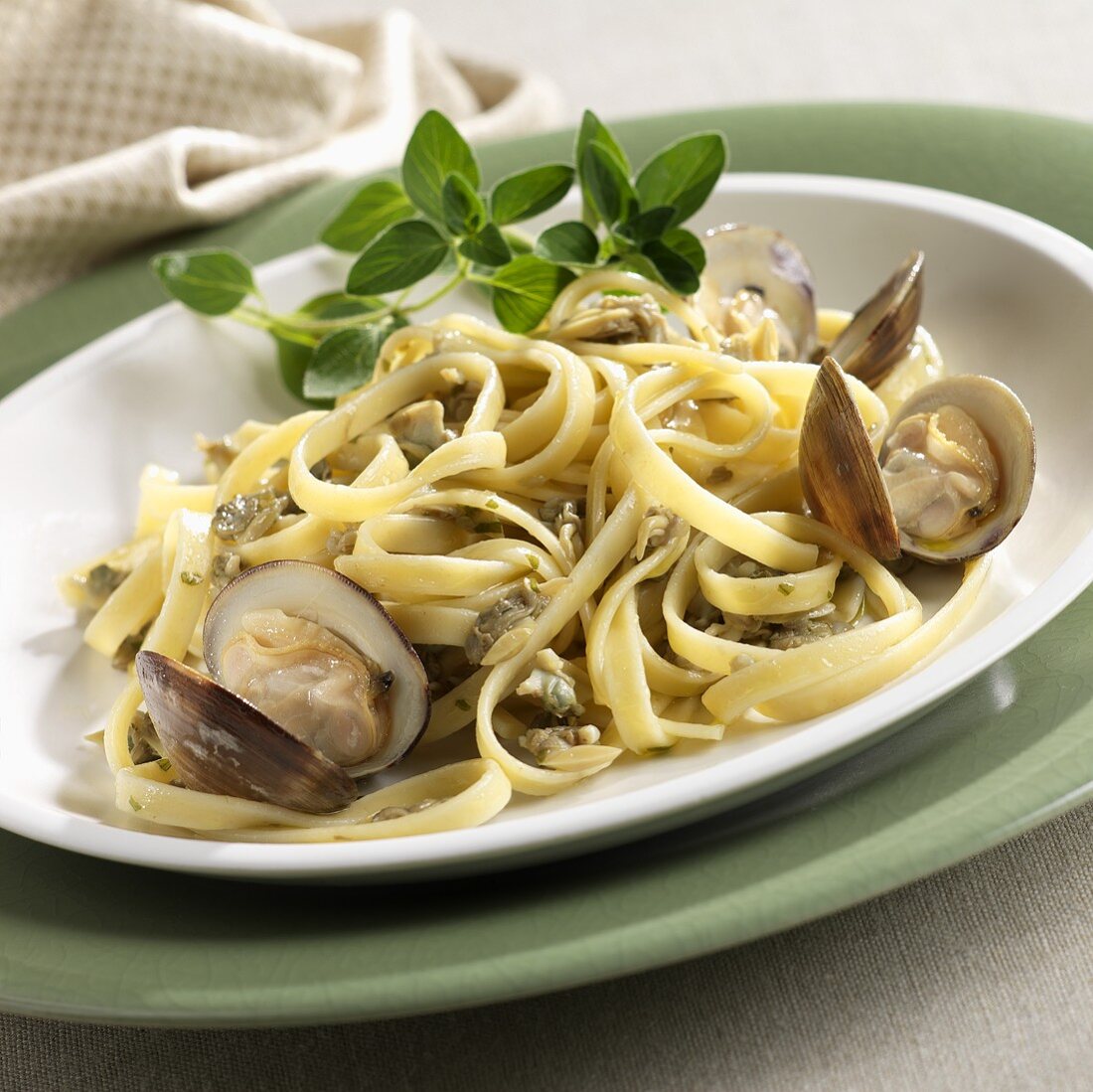 Pasta with White Wine Clam Sauce and Whole Clams on a Plate