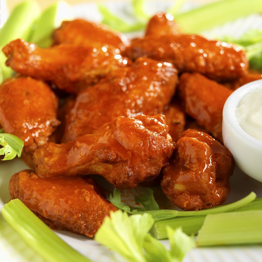Spicy Buffalo Wings with Blue Cheese Dressing and Celery; Close Up