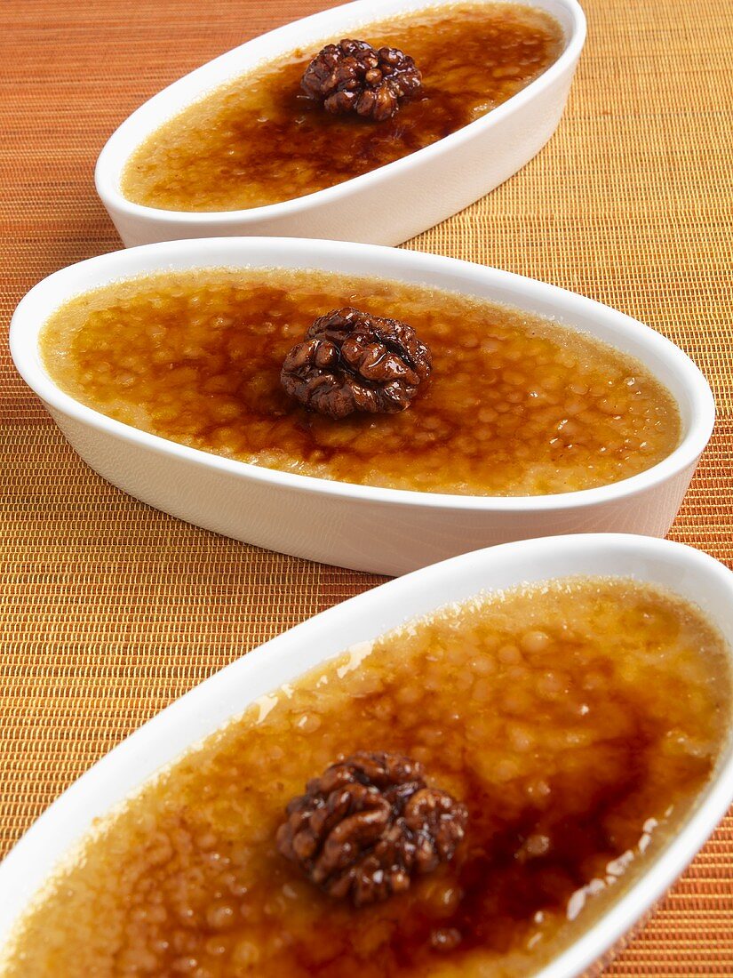 Three Individual Pumpkin Creme Brulee with Caramelized Walnuts; Close Up