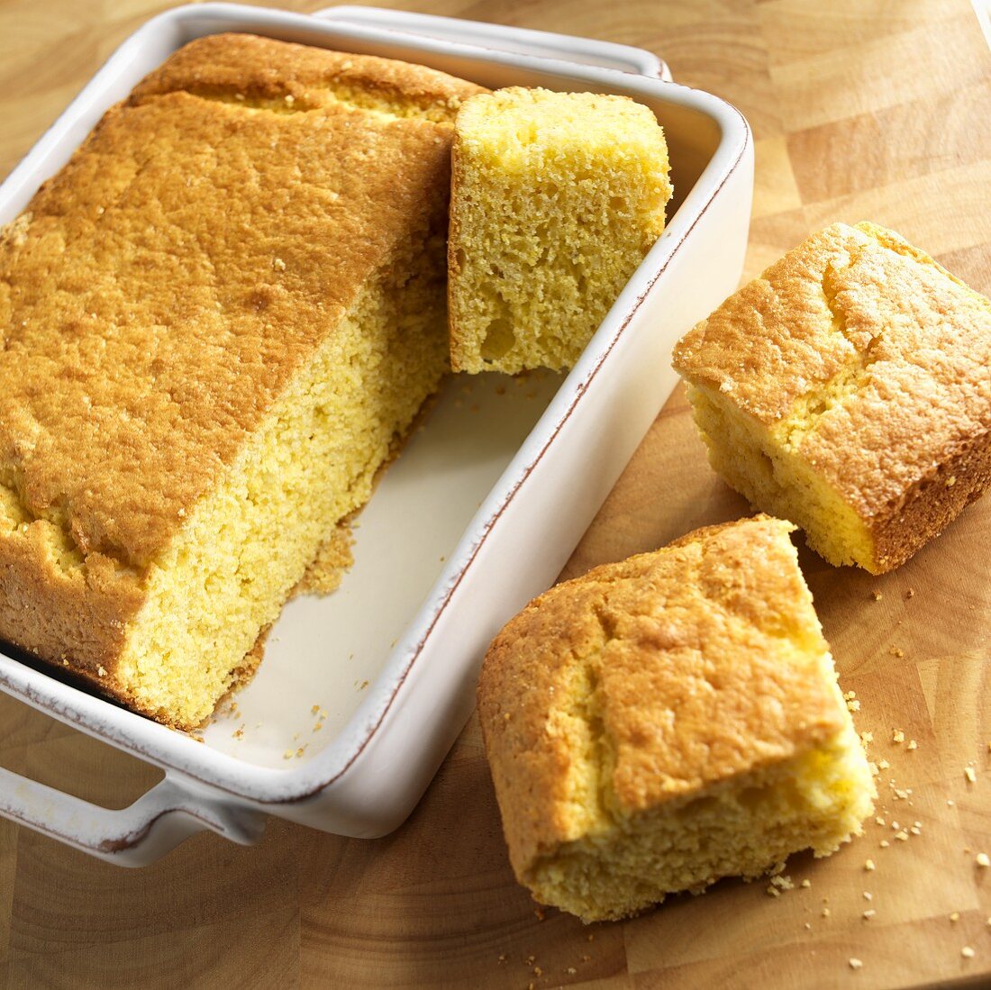 Corn Bread in Baking Dish with Square Pieces Cut Out