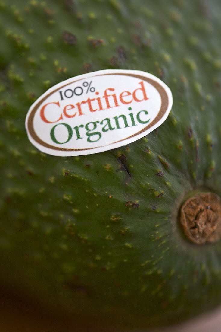 !00% Certified Organic Sticker on an Avocado