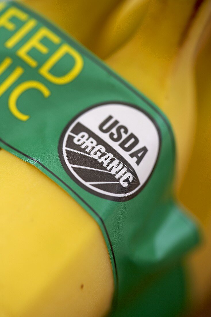 Close Up of Organic Banana Label on a Bunch of Organic Bananas