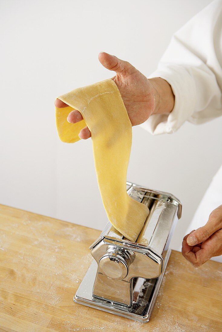 Making Pasta: Passing Sheet of Pasta Through a Pasta Maker