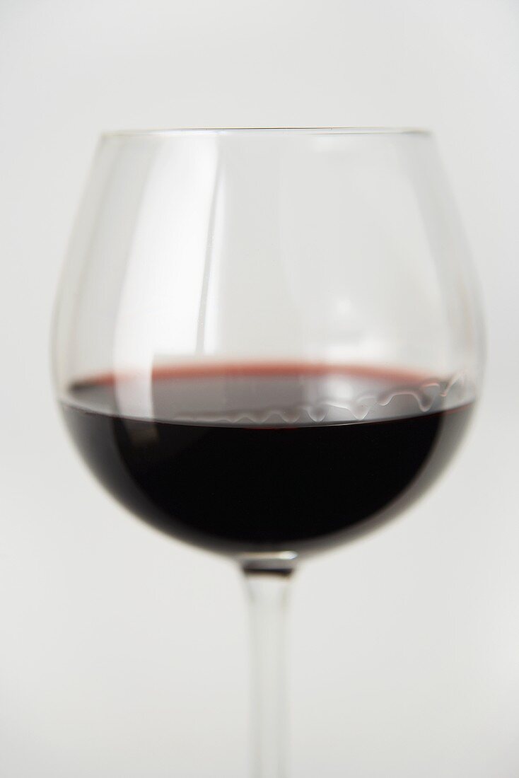Glass of Red Wine on a White Background