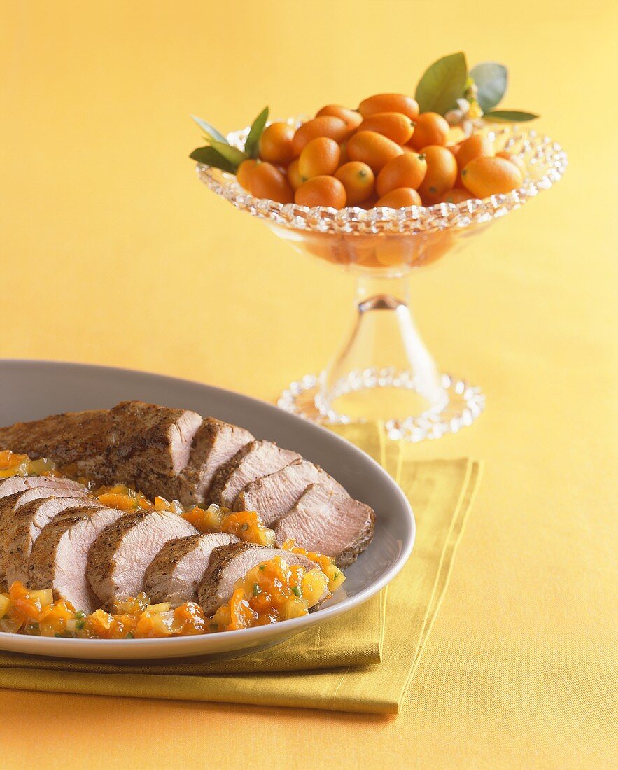 Platter of Sliced Pork Roast with Kumquats