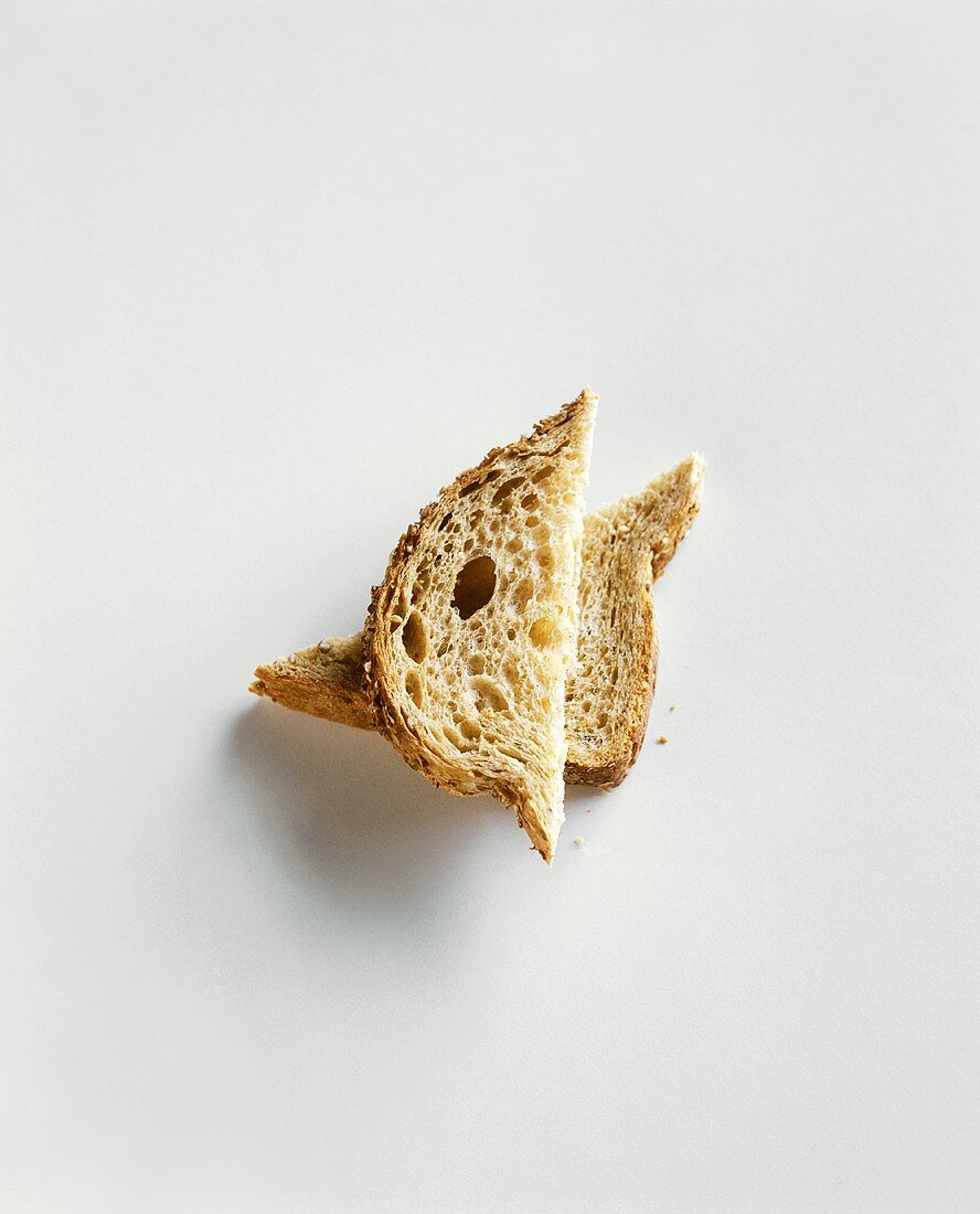 Two Piece of Bread Stacked on a White Background