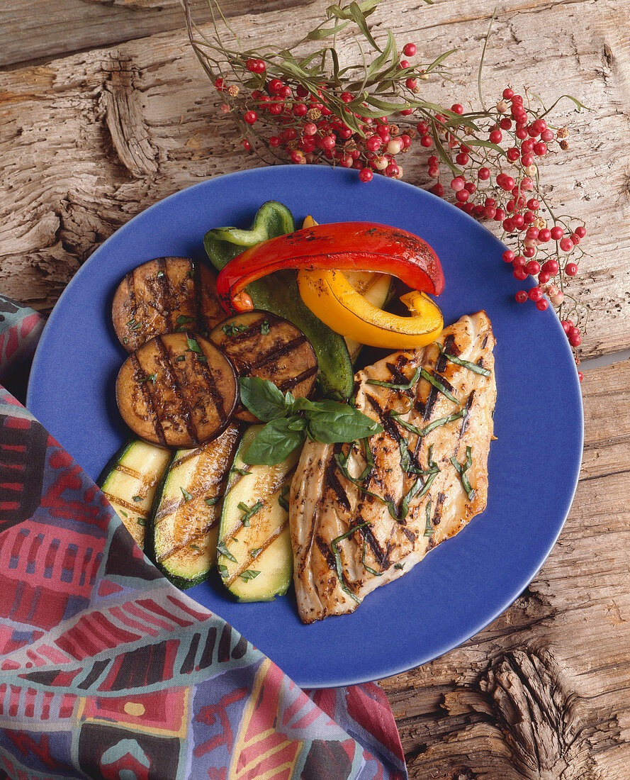 Grilled Bluefish with Grilled Vegetables on a Blue Plate