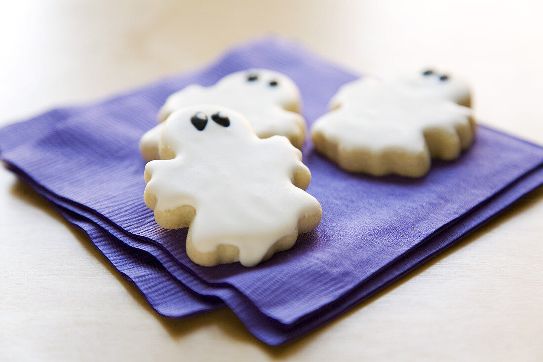 Three Ghost Cookies on Purple Napkins for Halloween
