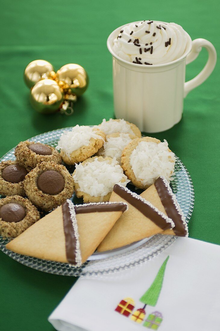 Assorted Cookies for Christmas on a Plate, Mug of Hot Chocolate, Decorations