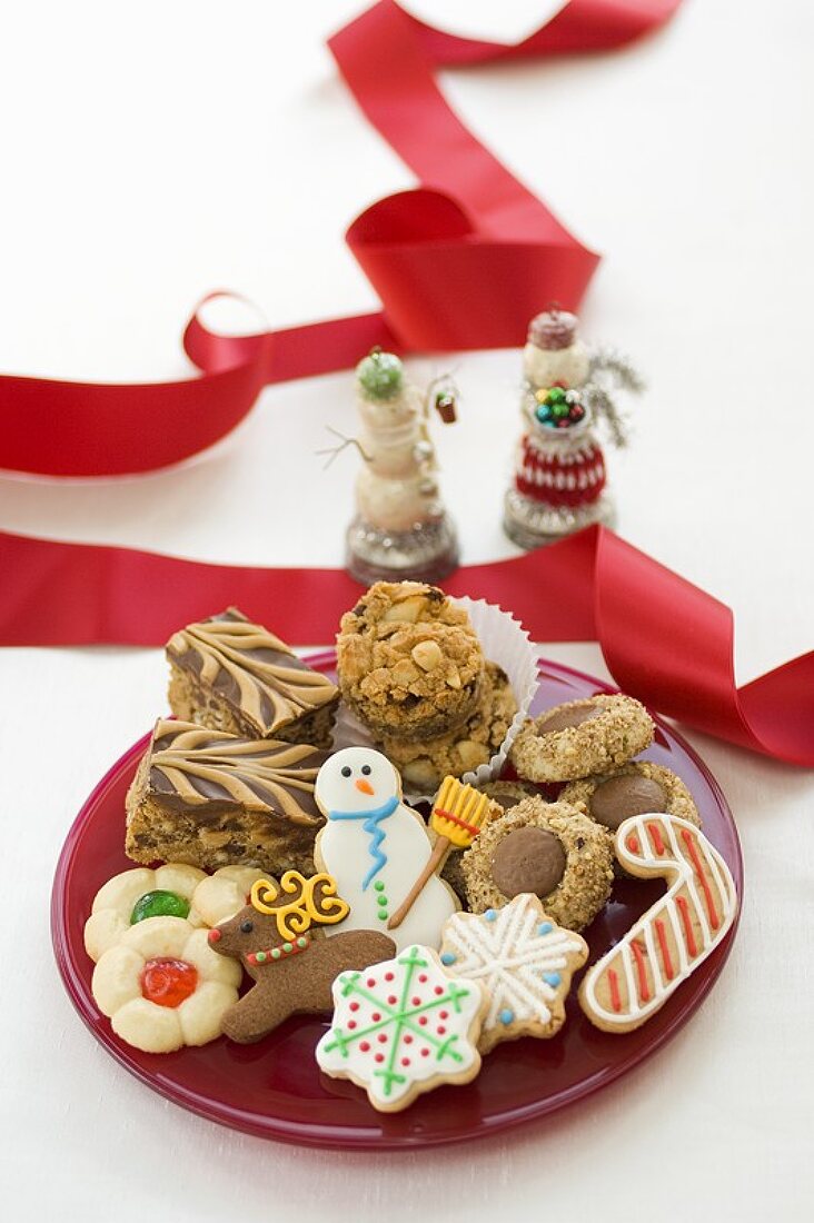 Plate of Assorted Christmas Cookies, Red Ribbon and Snowmen Figures