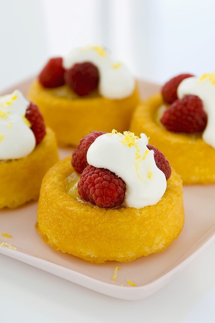 Raspberry Spongecakes with Whipped Cream on a Platter