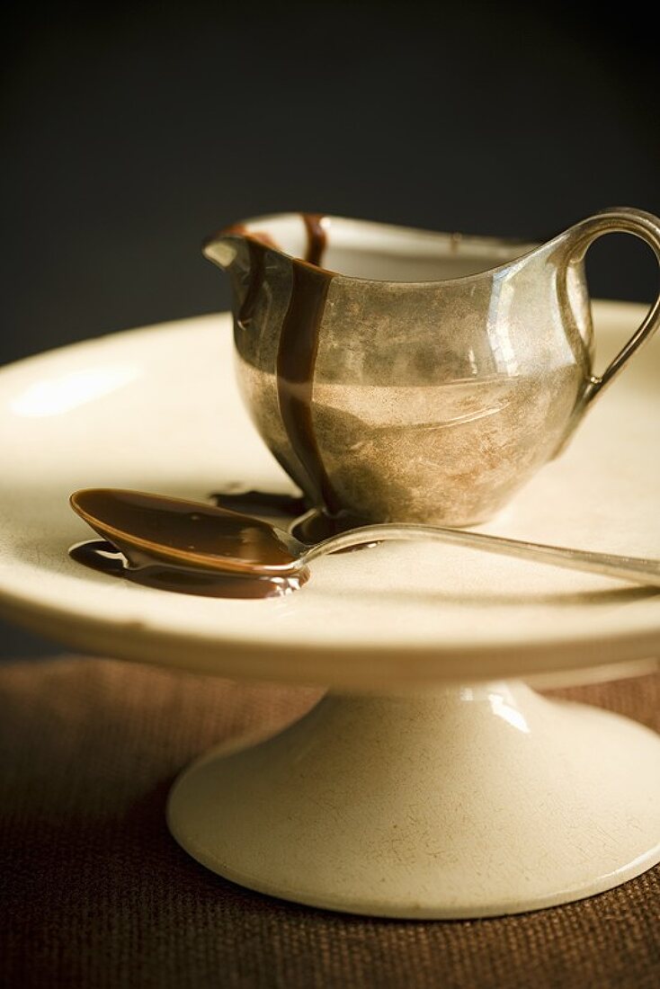 Chocolate Sauce in a Metal Pitcher, Spoon