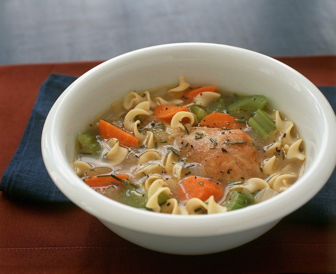 Bowl of Chicken Noodle Soup with Carrots and Celery