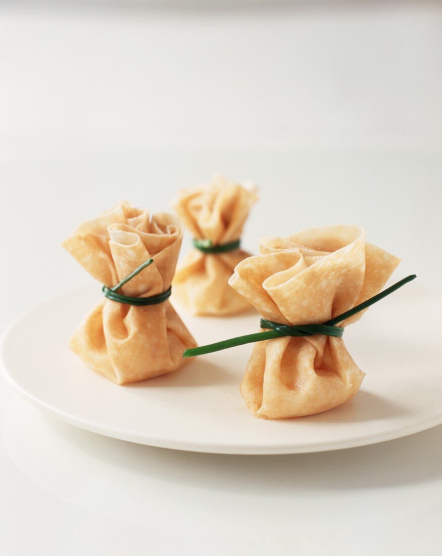 Asian Pouch Appetizers Tied with Chives
