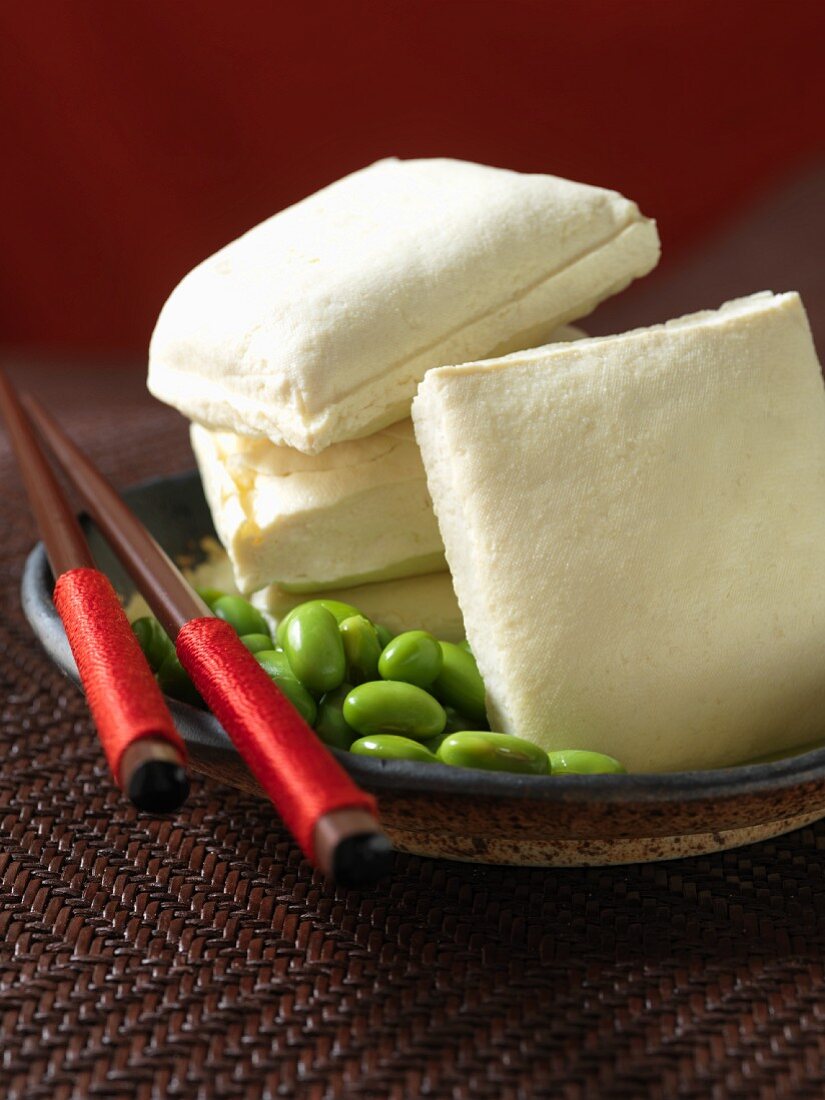 Several pieces of tofu & edamame (fresh young soya beans)