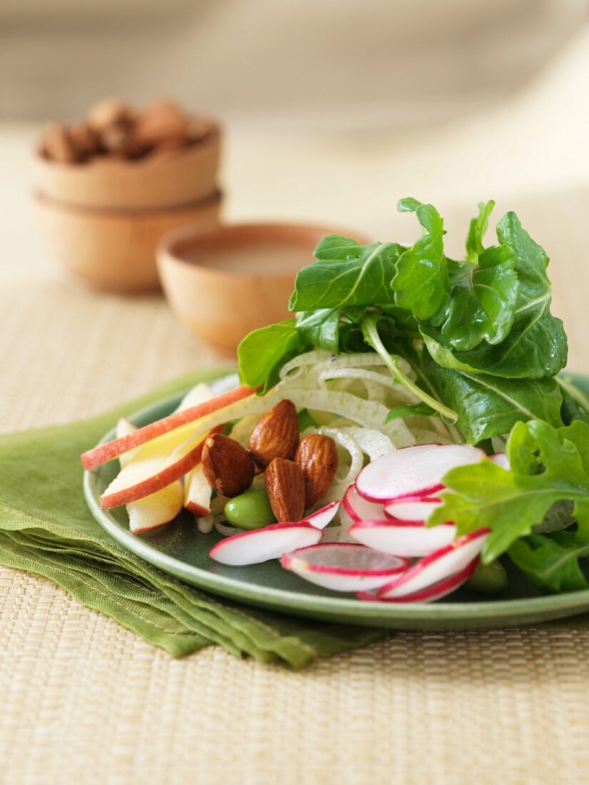 Green salad with radishes, almonds, apples and edamame