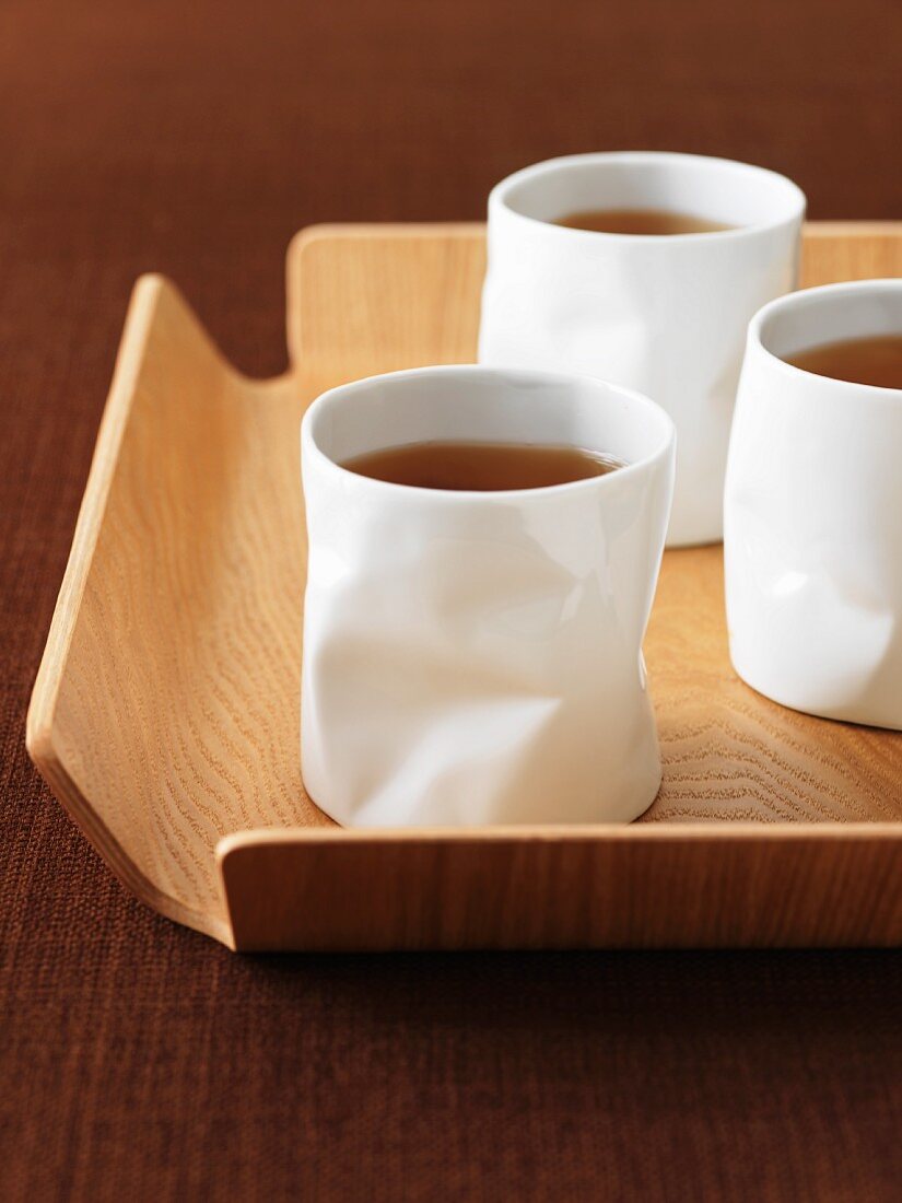 Tea in white beakers