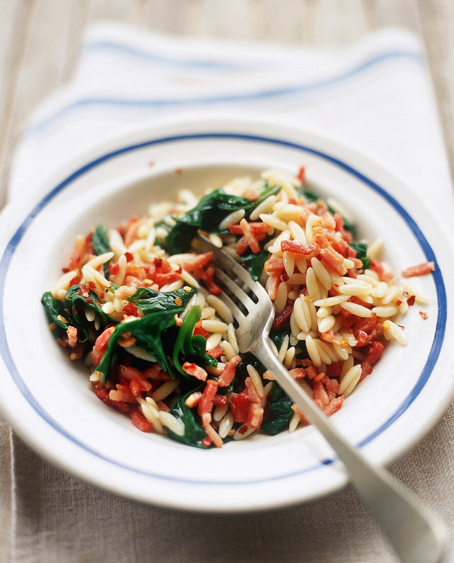 Bacon and Spinach Orzo in a Bowl with a Fork