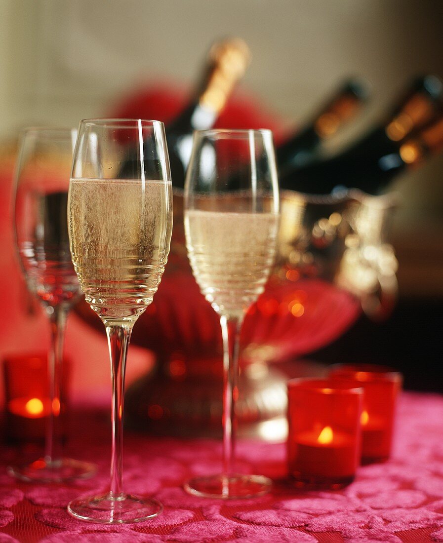 Champagne in Flutes; Bottles in an Ice Bucket; Candles