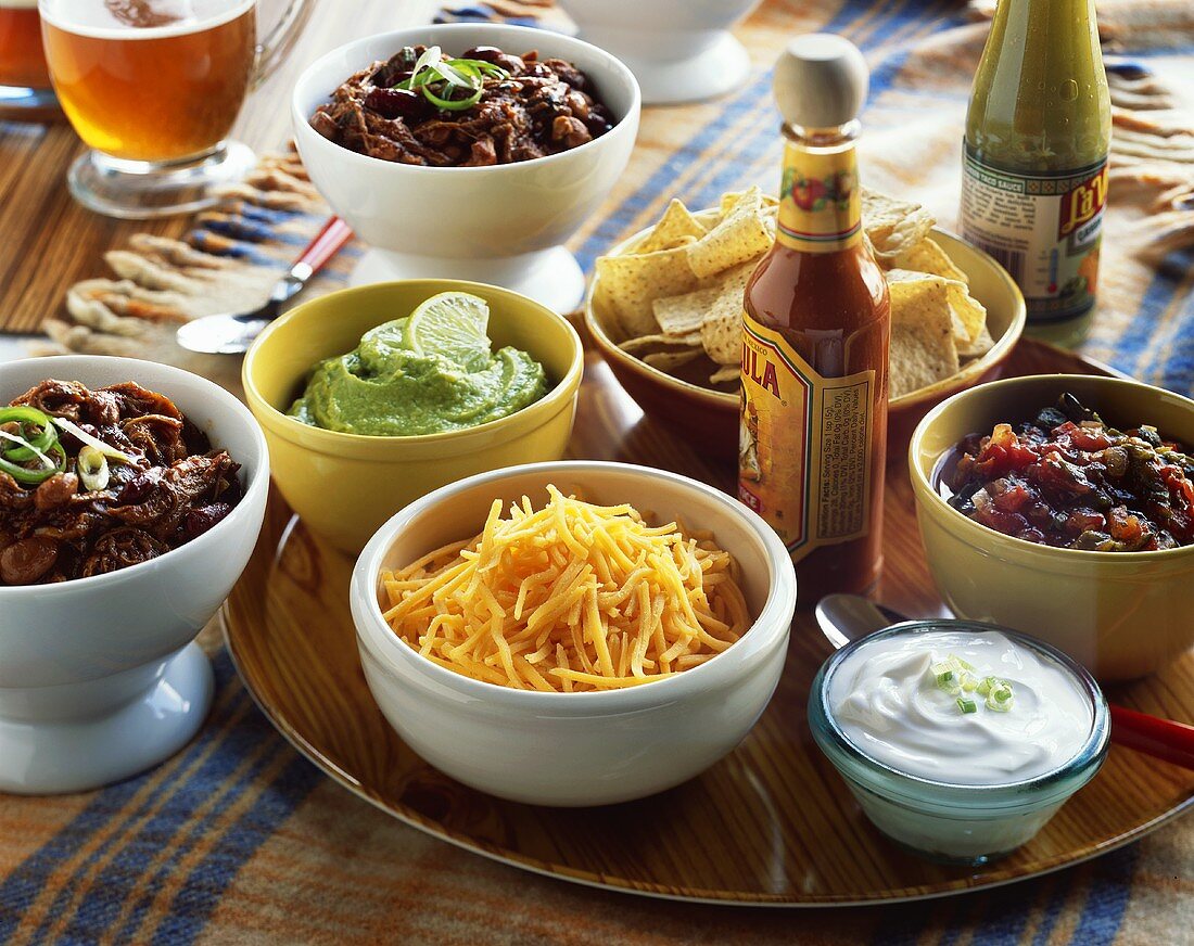 Nacho Platter with Cheese, Salsa and Guacamole; Bowls of Chili