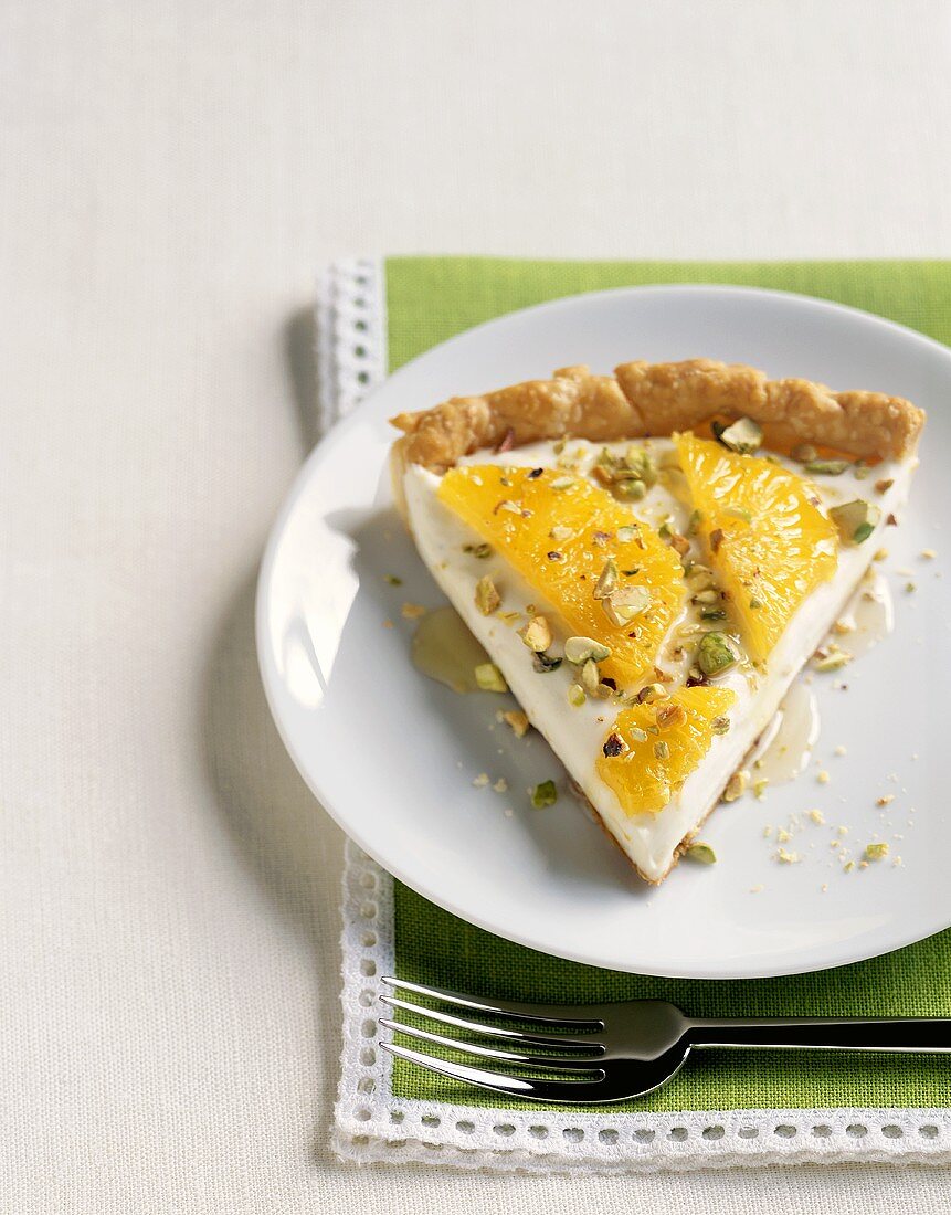 Slice of Pie Topped with Oranges and Pistachios