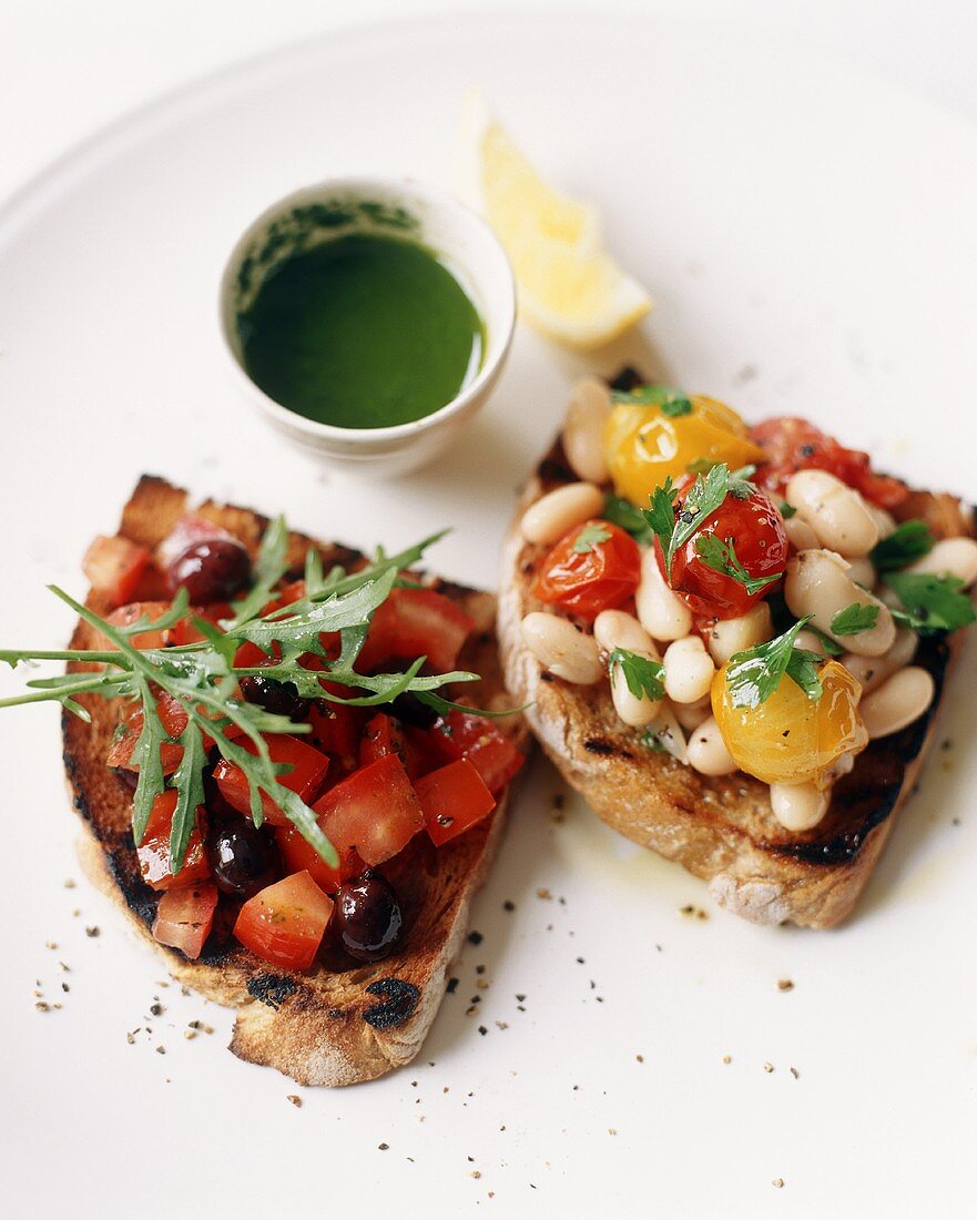 Two Pieces of Bruschetta: White Bean and Tomato and Tomato and Olive