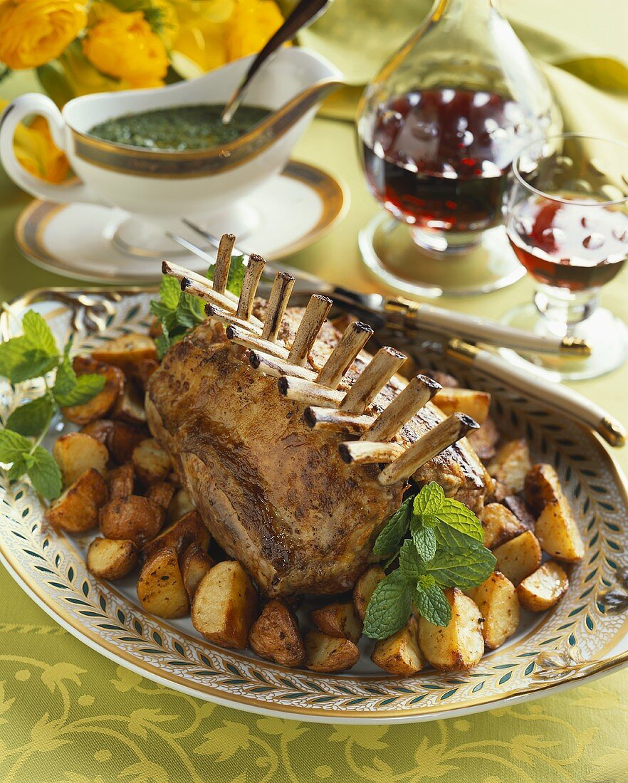Whole Rack of Lamb on a Platter with Potatoes