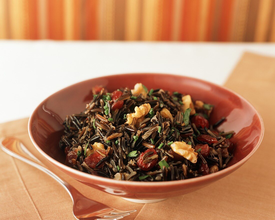 Bowl of Wild Rice Salad with Walnuts and Cranberries