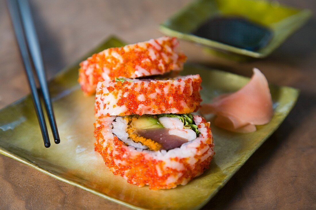 Inside-out rolls with caviar, avocado and tuna